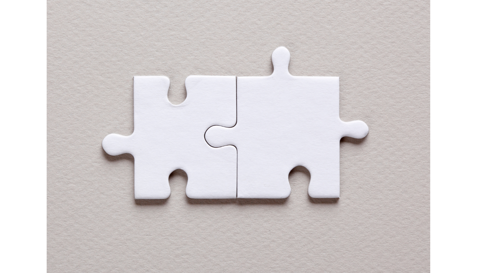 Partnerschaft im Handwerk Das Bild zeigt zwei ineinandergreifende Puzzleteile.